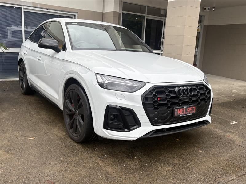 Black Ford F-150 pickup truck parked near a building with a PPG logo on the wall.— Airlie Beach Smash Repairs in Cannonvale, QLD