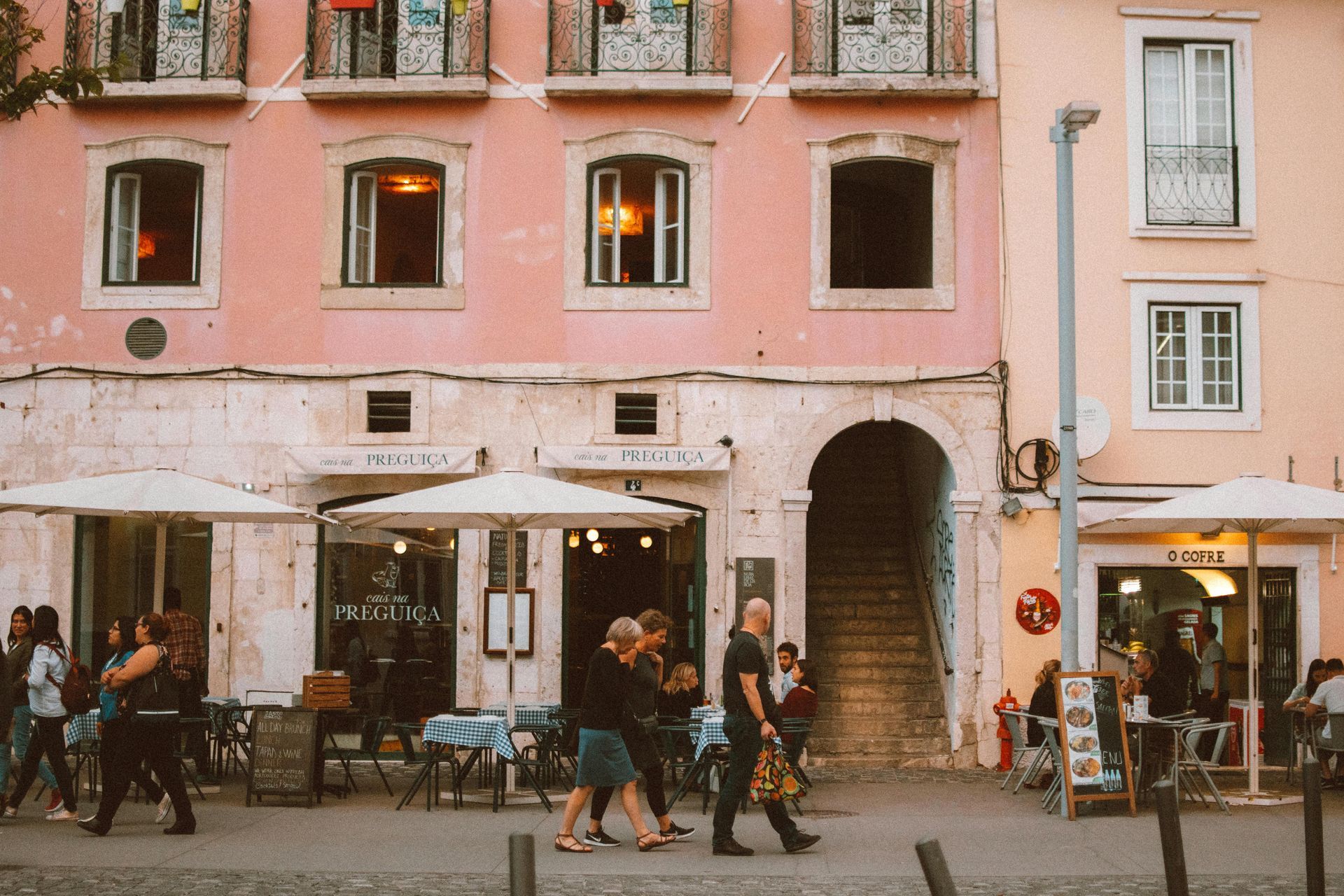 Street in Lisbon with pink restaurant