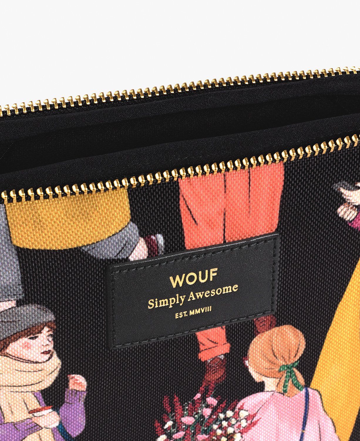 Eine Nahaufnahme eines Reißverschlusses an einer Wouf-Handtasche