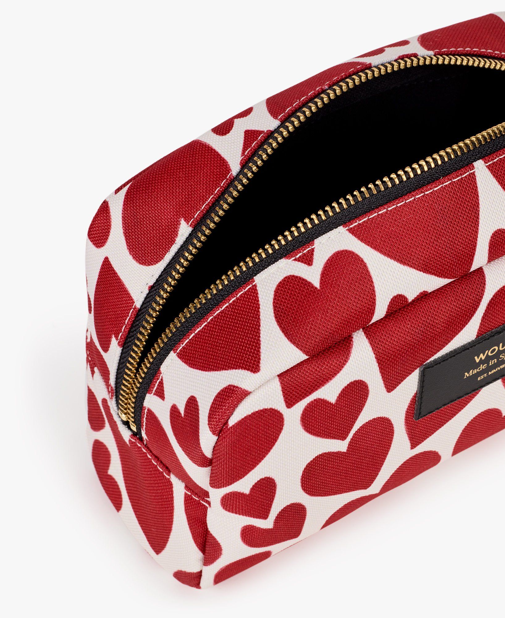 Ein rot-weißes Federmäppchen mit Herzen darauf