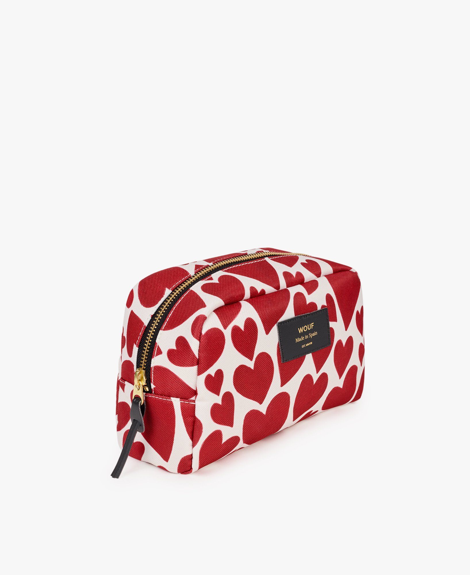 Eine rot-weiße Kosmetiktasche mit roten Herzen darauf.