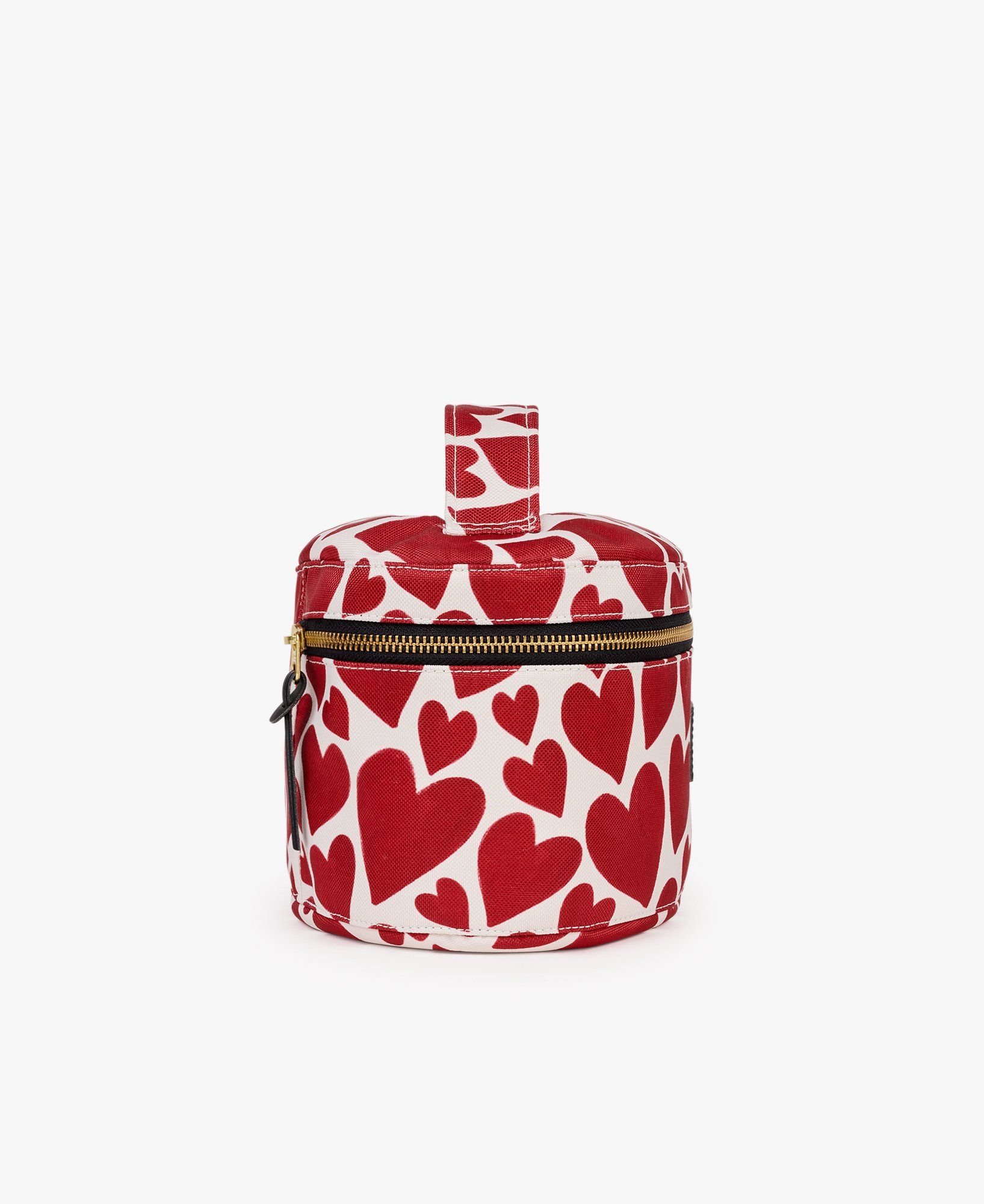 Eine rot-weiße Kosmetiktasche mit Herzen darauf.