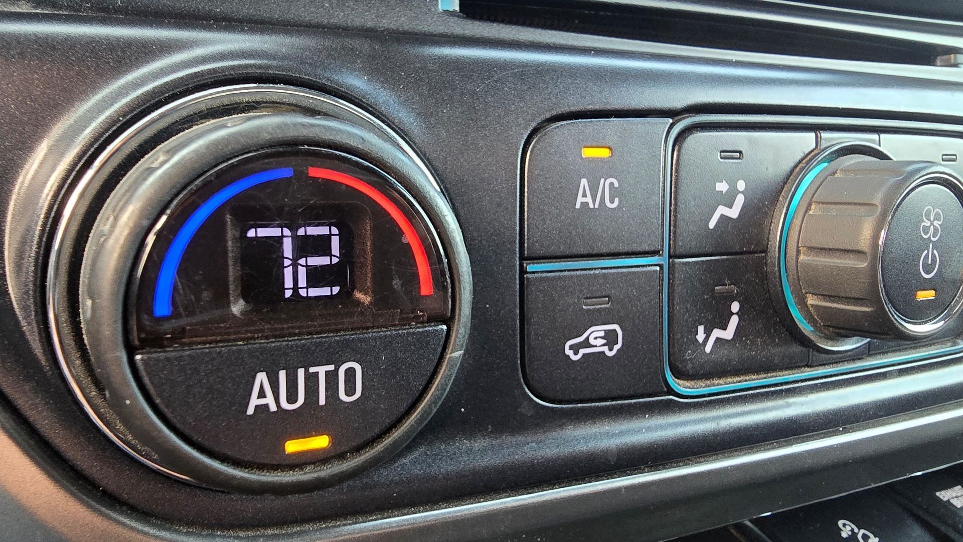 Car dashboard climate controls showing 72°F, auto mode, A/C, and fan settings.