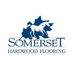 Somerset Hardwood Flooring logo: blue horse silhouette inside a blue leaf; text 
