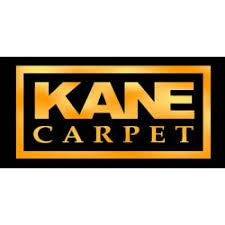 Kane Carpet logo with gold text and border on a black background.