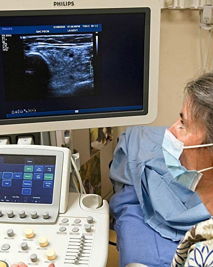 Sonographer reviews ultrasound image