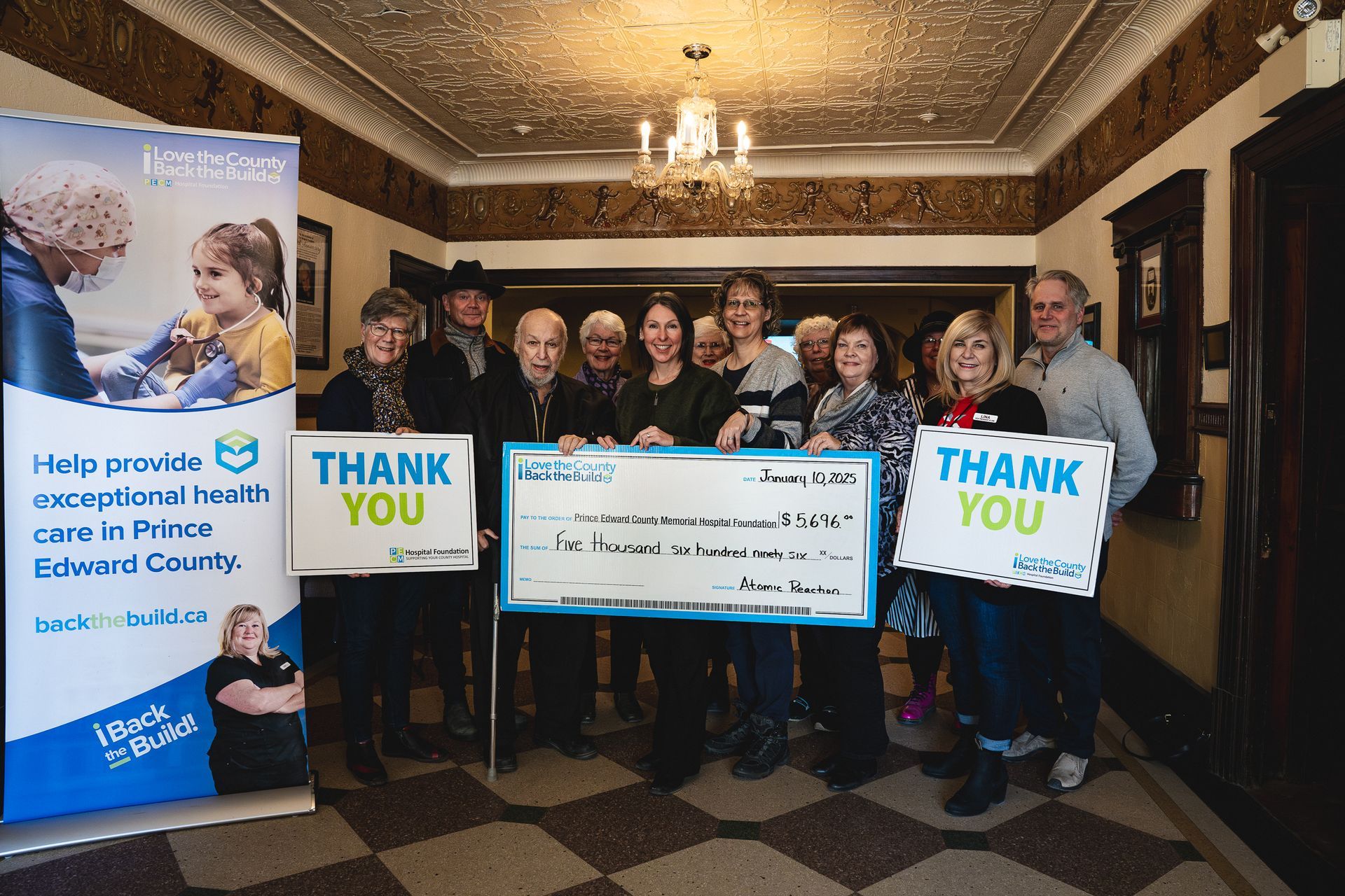 Cheque presentation for Atomic Reaction film screening at the Regent Theatre in Picton.