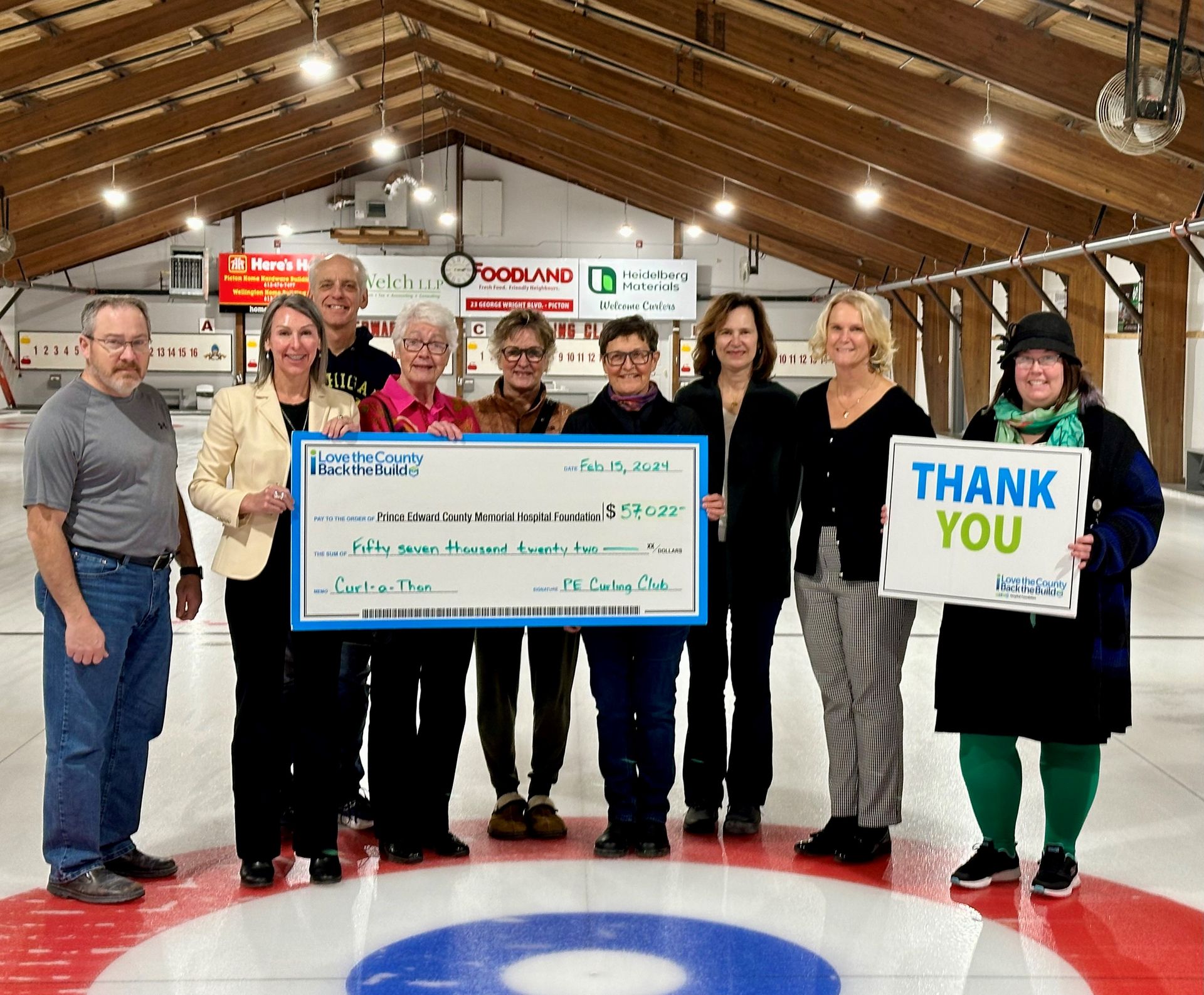 Cheque presentation photo with members of the Curl-a-Thon committee.