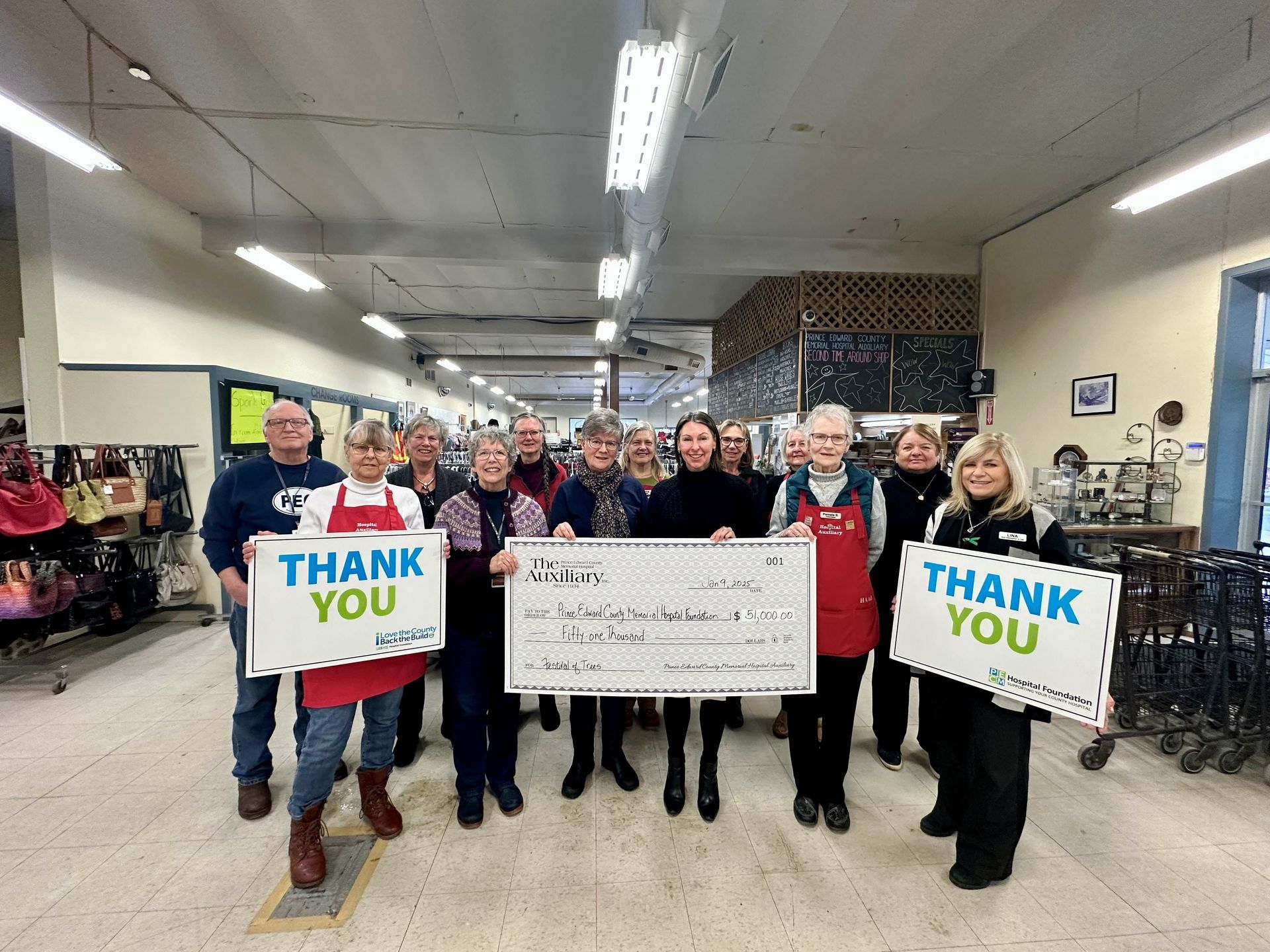 Cheque presentation photo with PECMH Auxiliary to celebrate the 2024 Festival of Trees results.