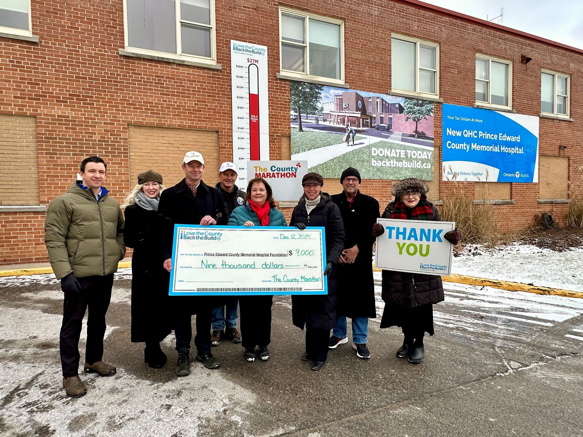 Members of the County Marathon Committee pose with representatives from PECMHF.