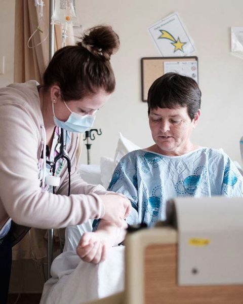 Nurse begins an IV on patient