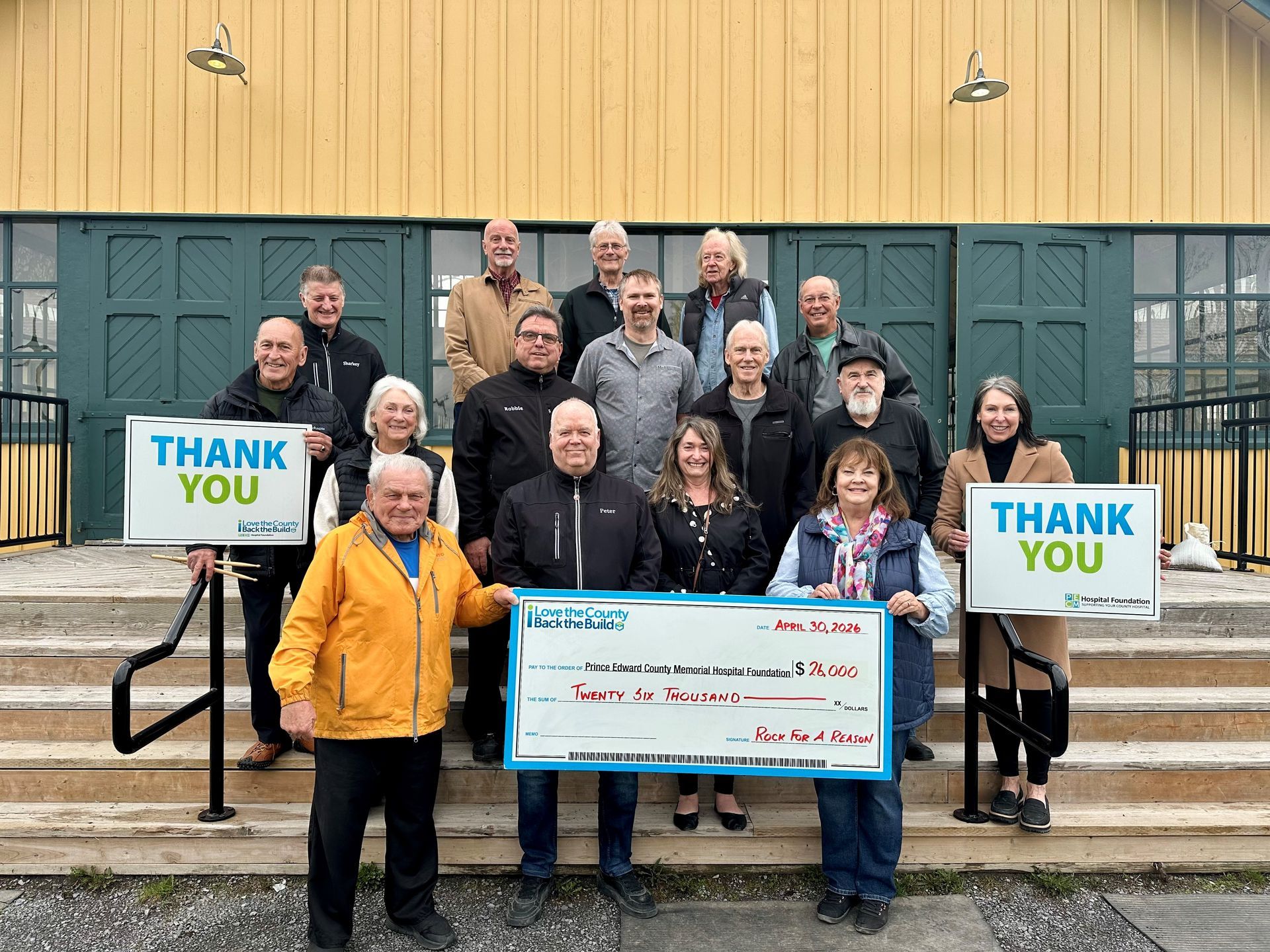 Members of the Rock for a Reason organizing committee present 26,000 to PECMH Foundation.