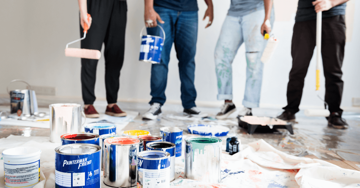 A group of people are painting a room together.