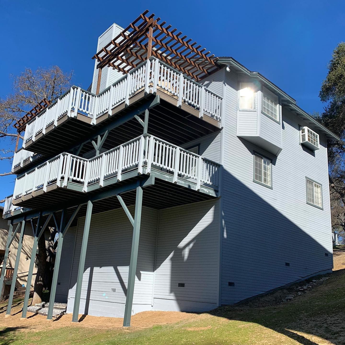 A large house with a lot of balconies and a garage.