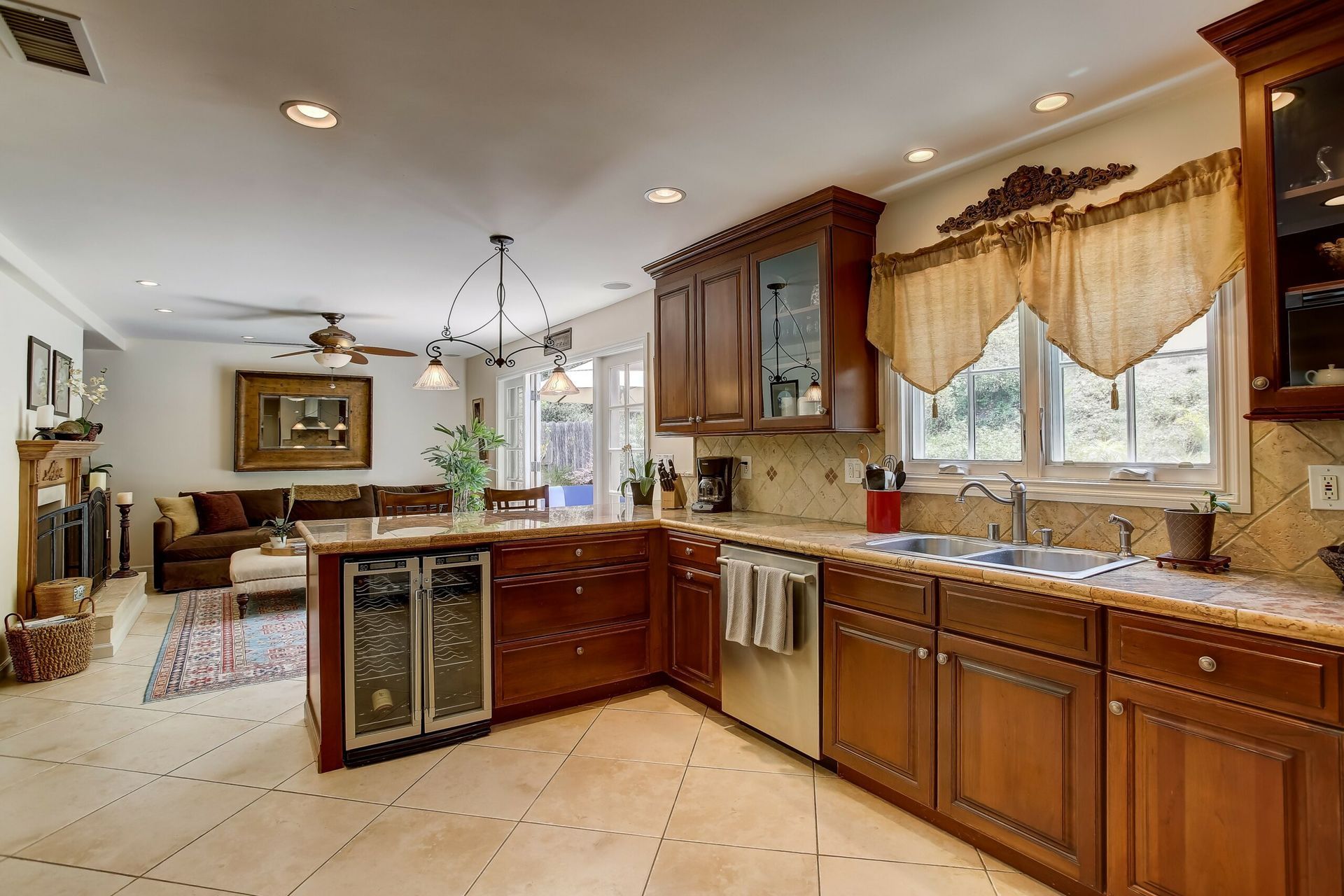 A kitchen with stainless steel appliances and wooden cabinets