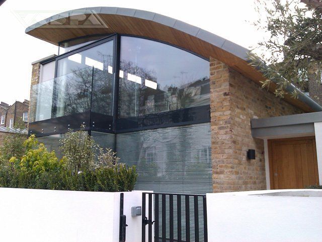 Glass fronted building with curved roof