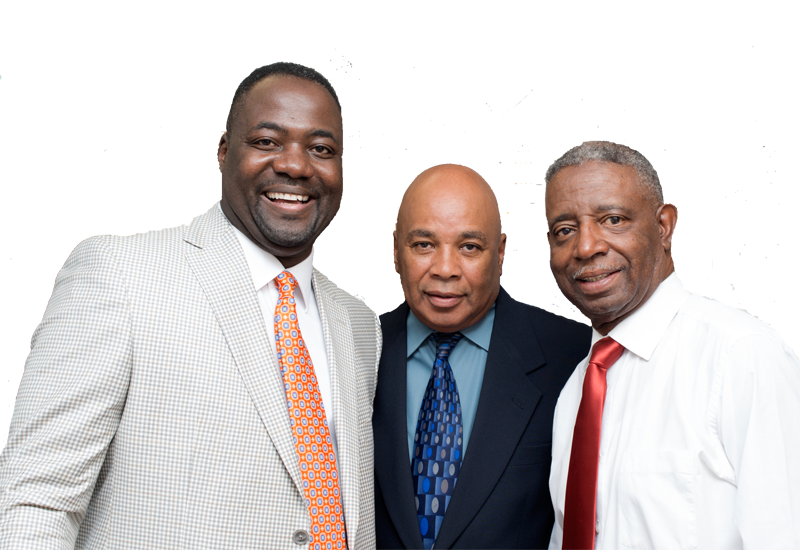 Three men in suits and ties are posing for a picture