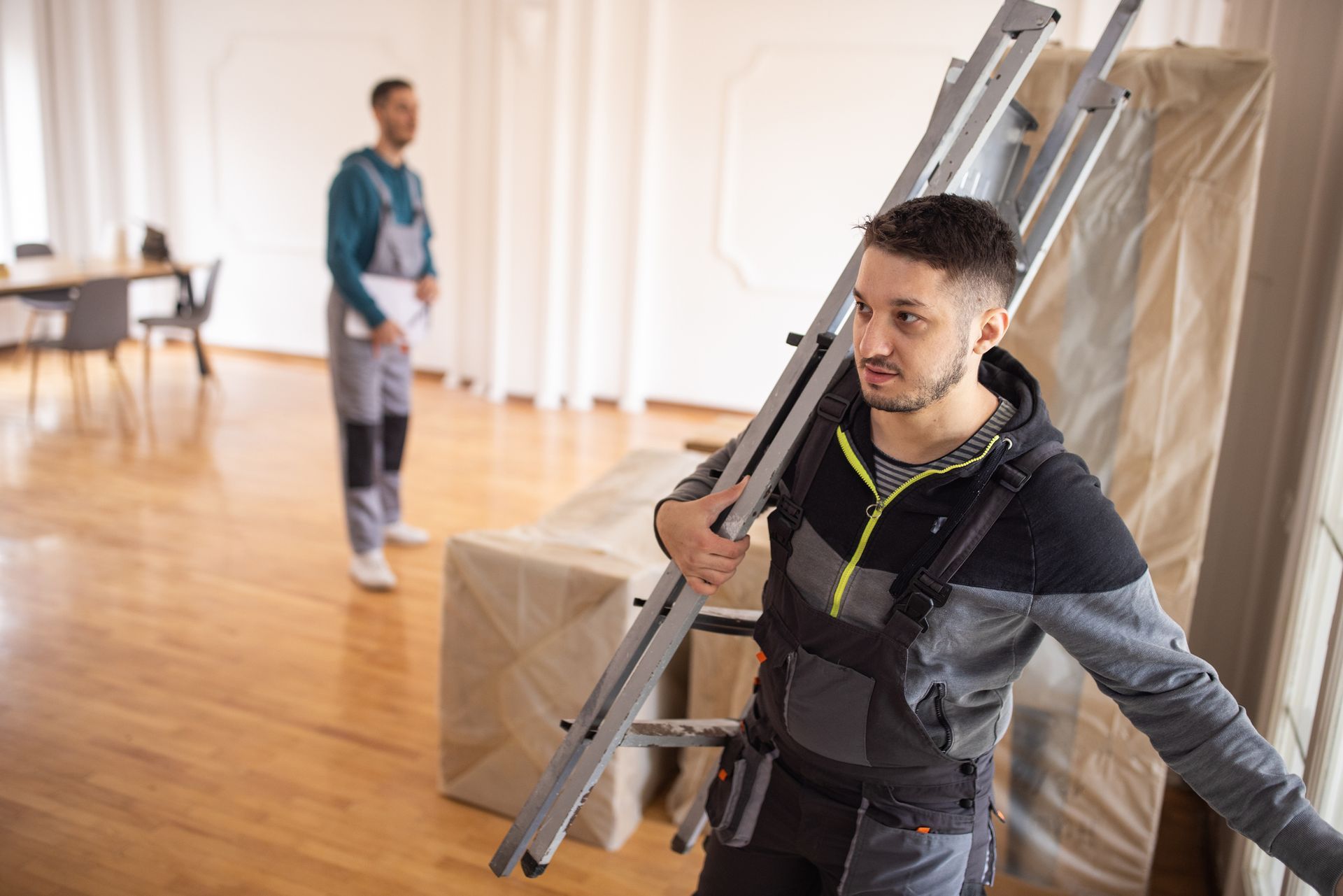 Removalists crew entering a client's house. Removalists crew entering a client's house.