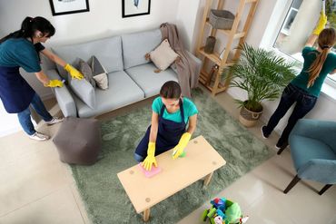 Three Cleaners Cleaning a Room