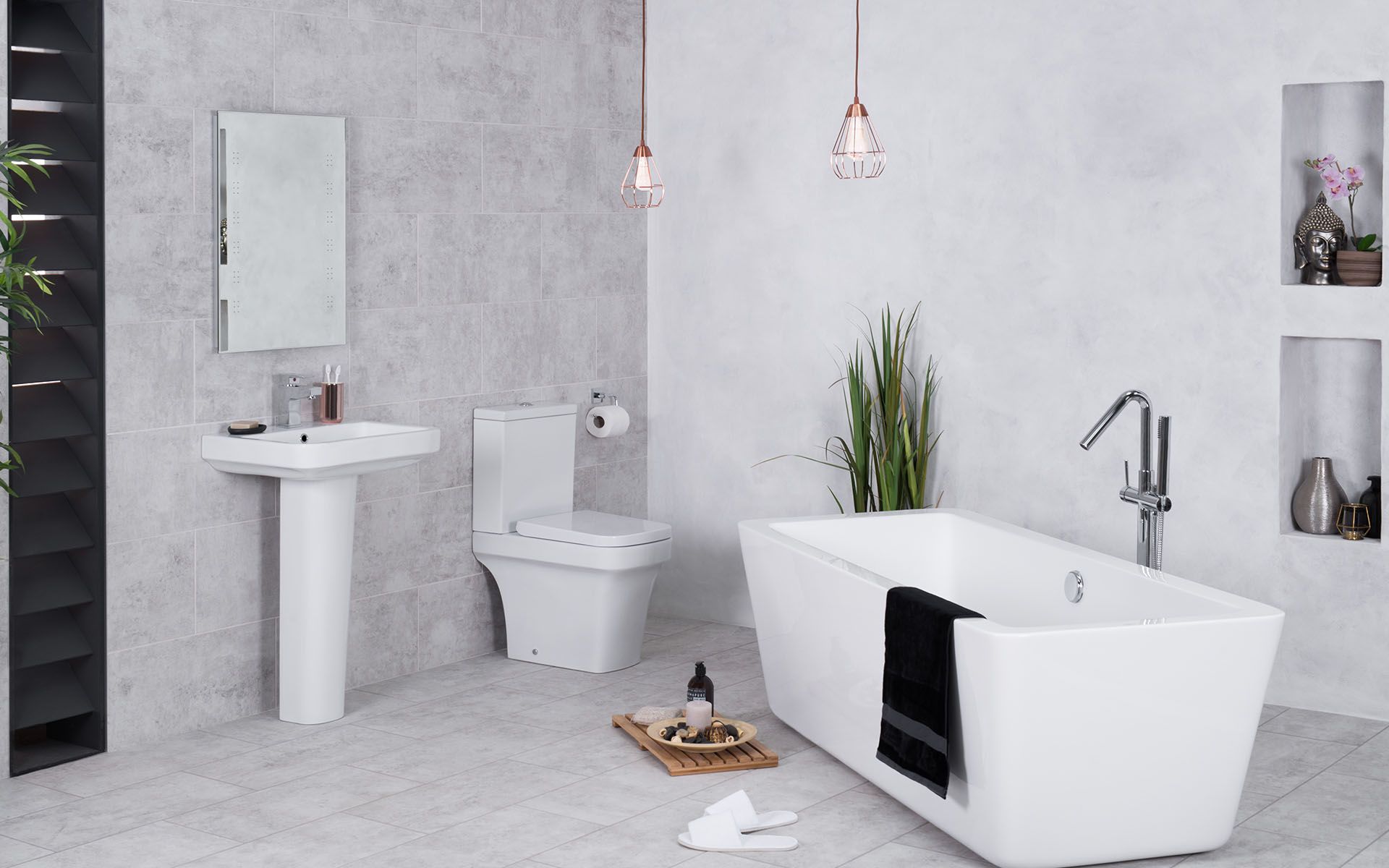 A Bathroom with A Bathtub, Toilet, Sink and Mirror — Maid In Bowral in Goulburn, NSW