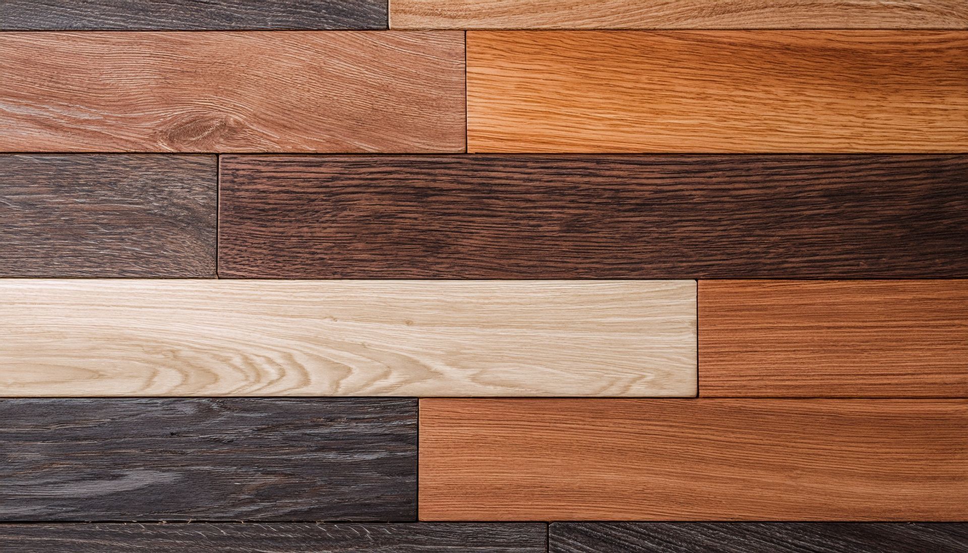 Wooden planks in various shades of brown, beige, and gray arranged horizontally.