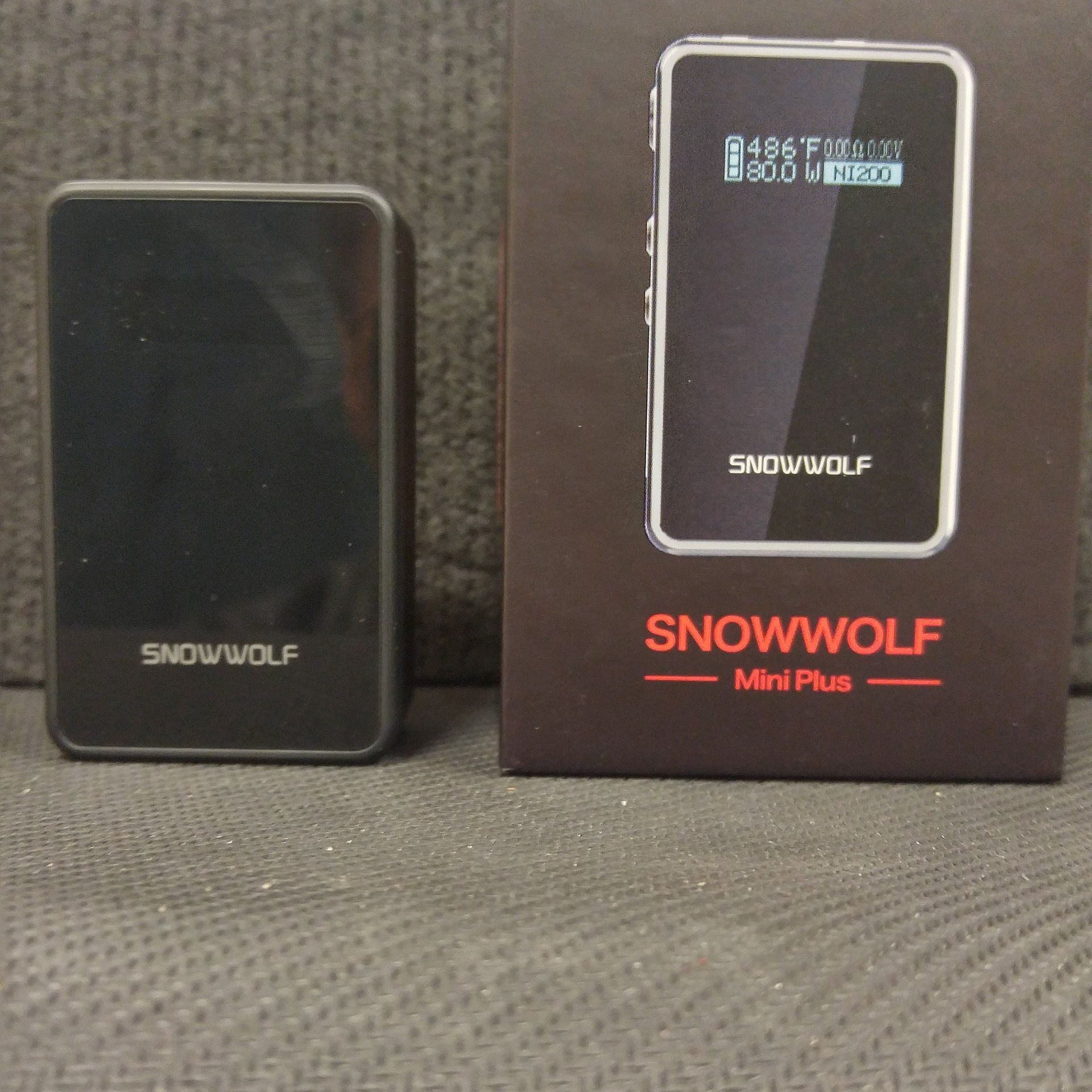 A snowwolf mini plus device sits next to its box