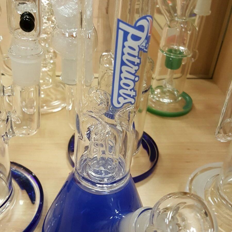 A blue beaker with the word patriots on it