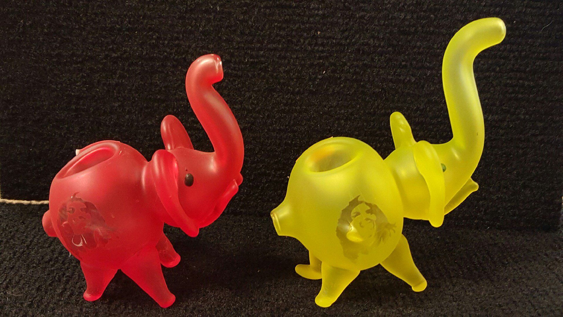 A red elephant and a yellow elephant water pipes