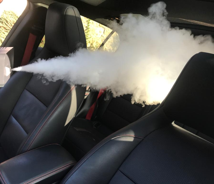 Car being thermally fogged with COV-RID High Level Disinfectant Fogging Solution