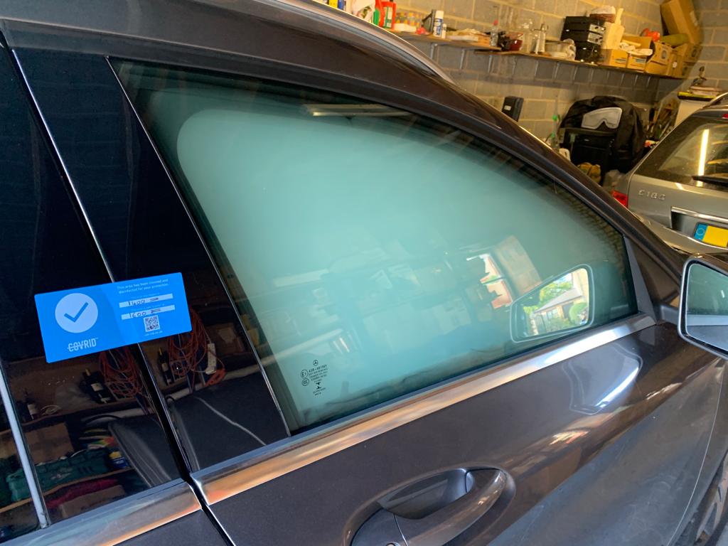 Car filled with COV-RID High Level Disinfectant Fog and Car door sealed with COV-RID Tamper Evident Door Seal