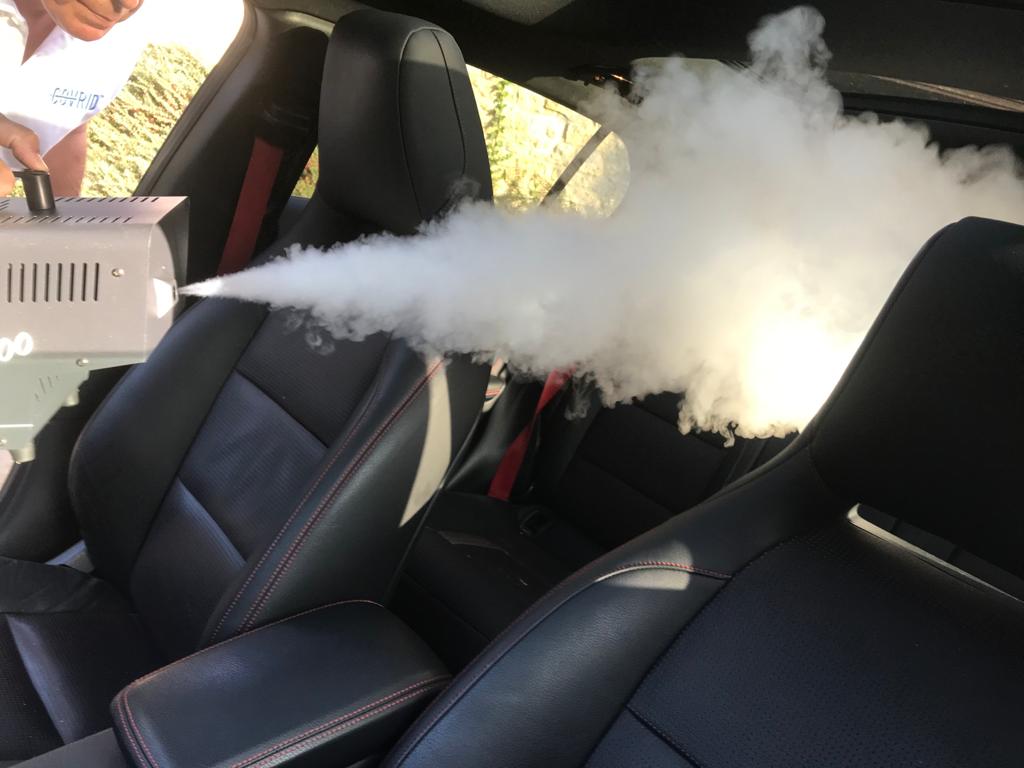 Car being fogged with COV-RID High Level Disinfectant Fogging Solution killing coronavirus