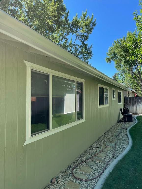 A house with a lot of windows on the side of it.