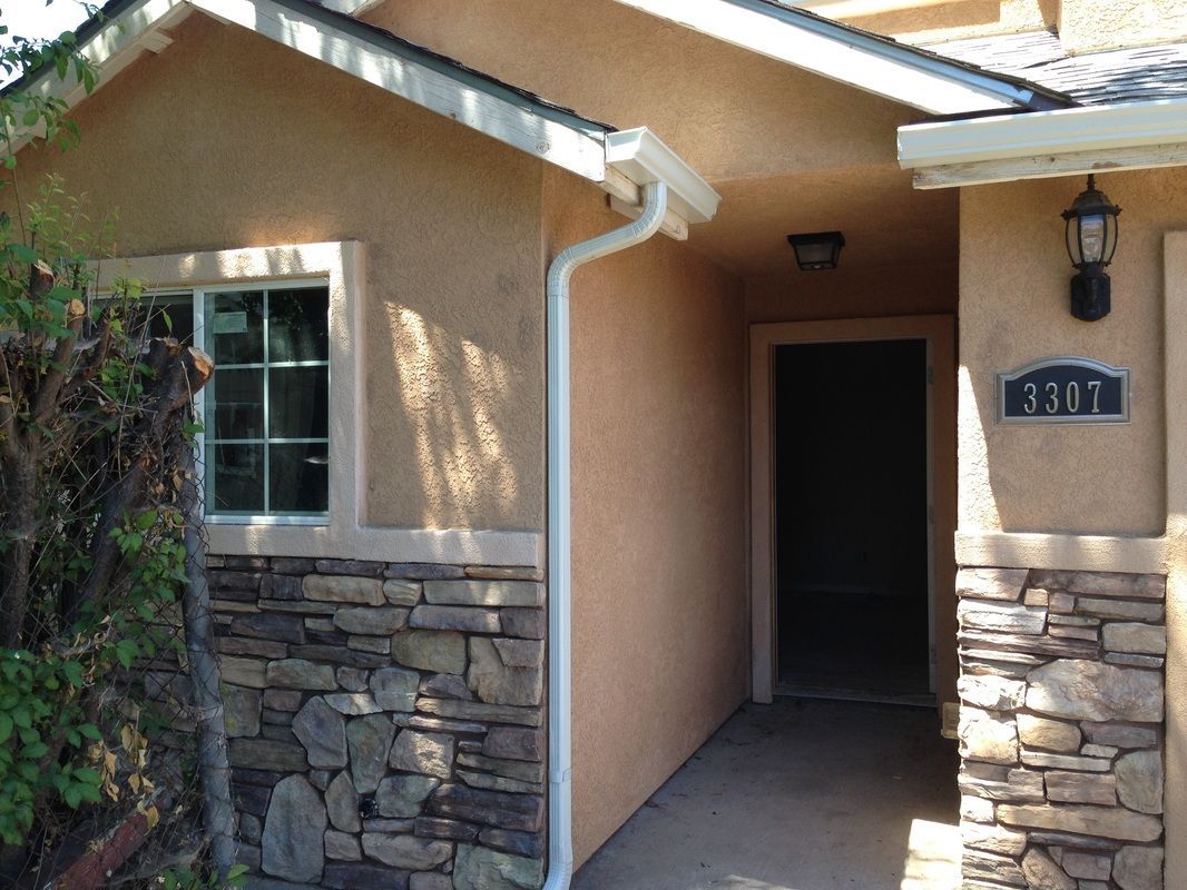 The number 1301 is on the front of a house