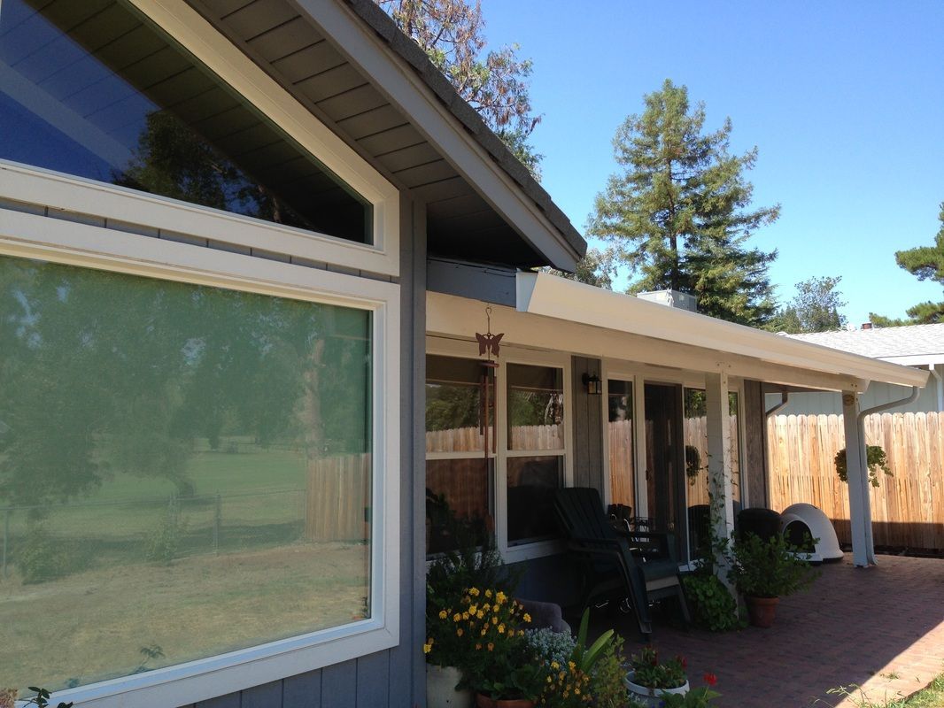 A house with a porch and a lot of windows