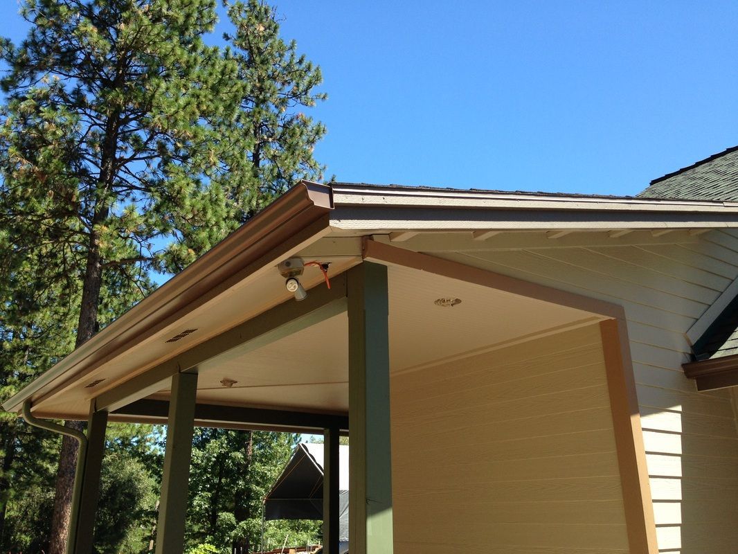 A house with a roof that has a gutter on it