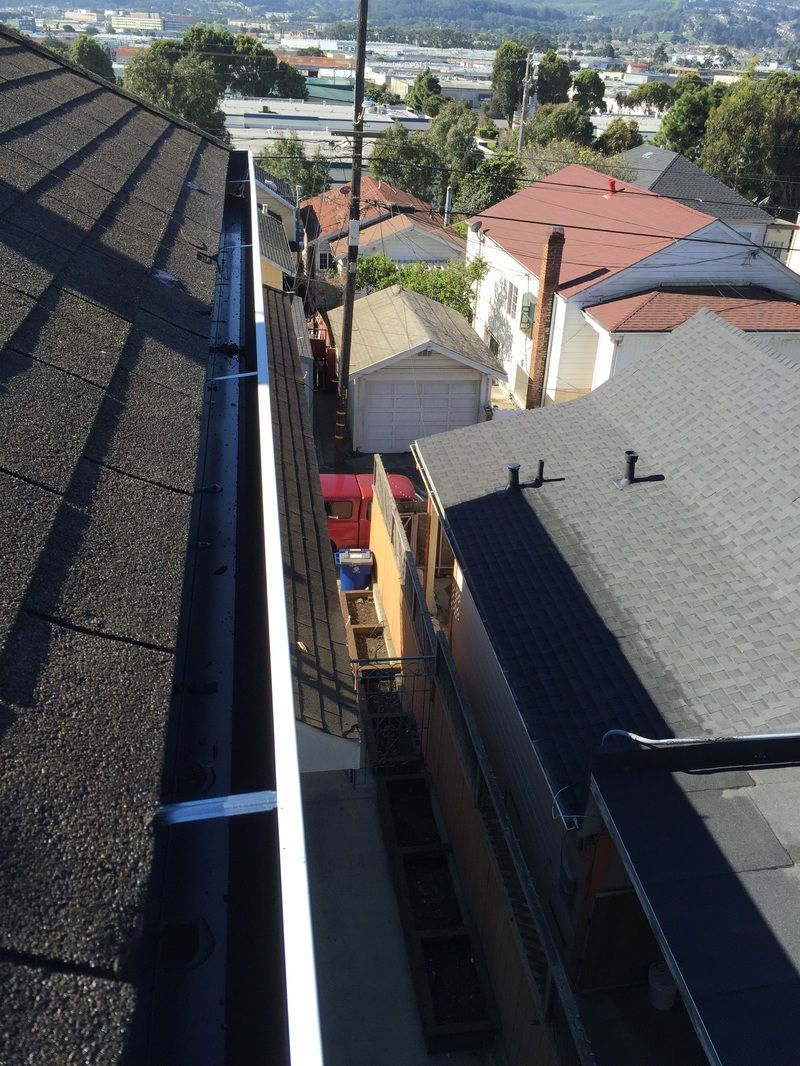 An aerial view of a gutter on the roof of a building.