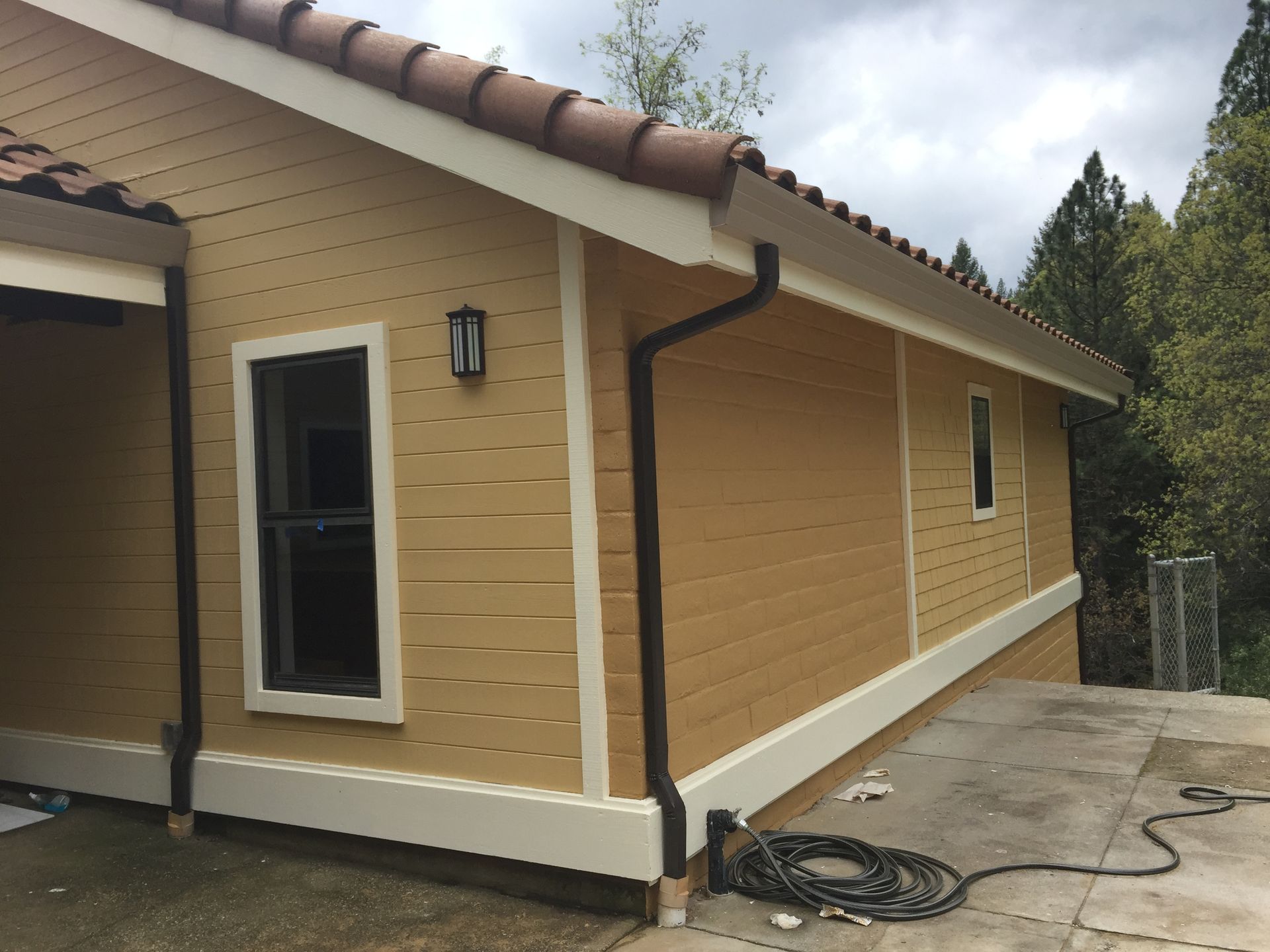 A house with a gutter on the side of it