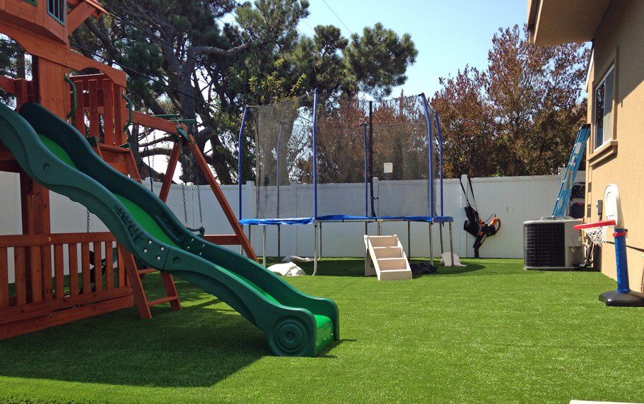 fully furnished playground area in Gilbert AZ. artificial grass installed by Gilbert Artificial Turf & Green