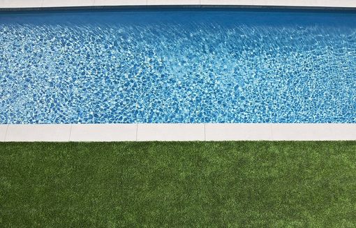 Artificial grass as pool deck in a Gilbert AZ swimming pool