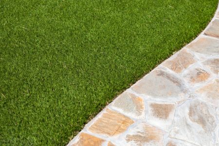 artificial turf laid next to a paved walkway in a Scottsdale AZ property