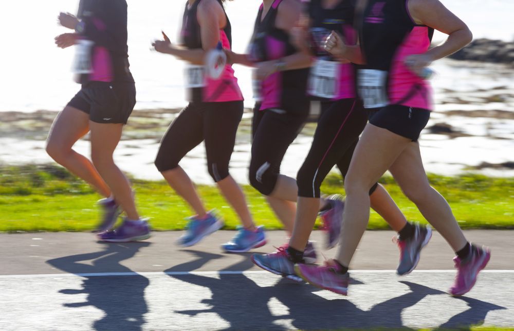 A Group Of Women Are Running In A Race With Numbers On Their Shirts — Pink Up Gold Coast in Southport, QLD