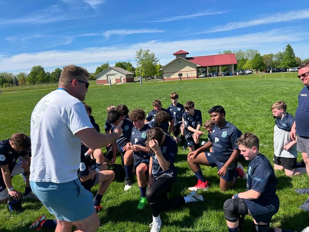 Coaches guiding athletes during a high-intensity training session