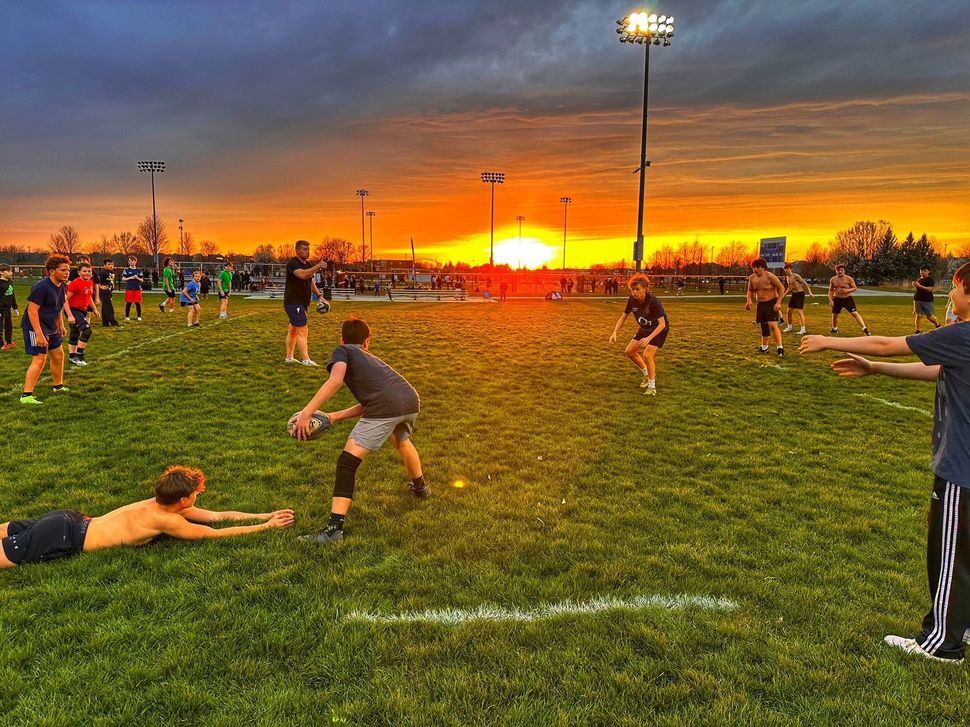 Scrum locking in with intense force and teamwork