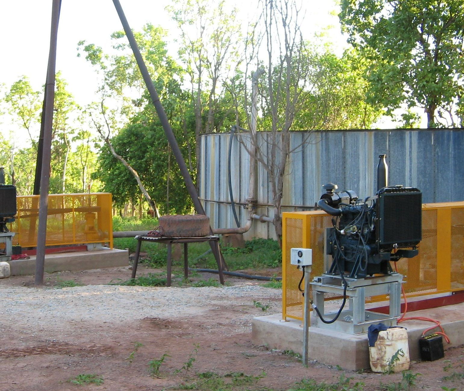 A fenced in area with a few trees in the background