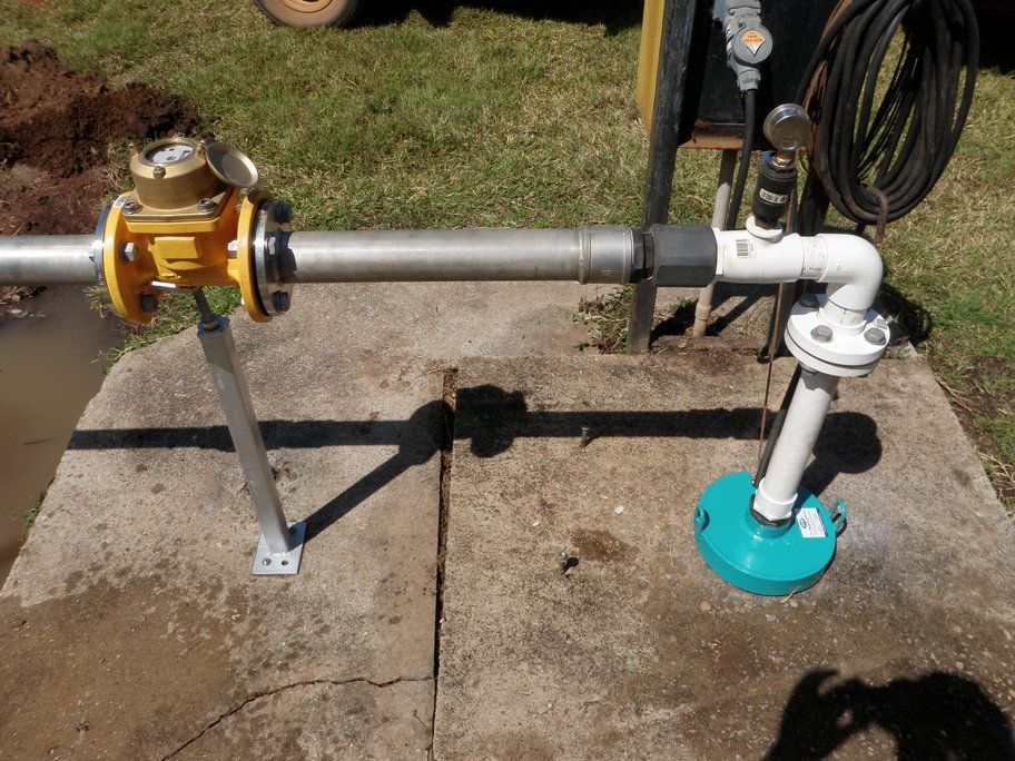 A pipe with a water meter attached to it