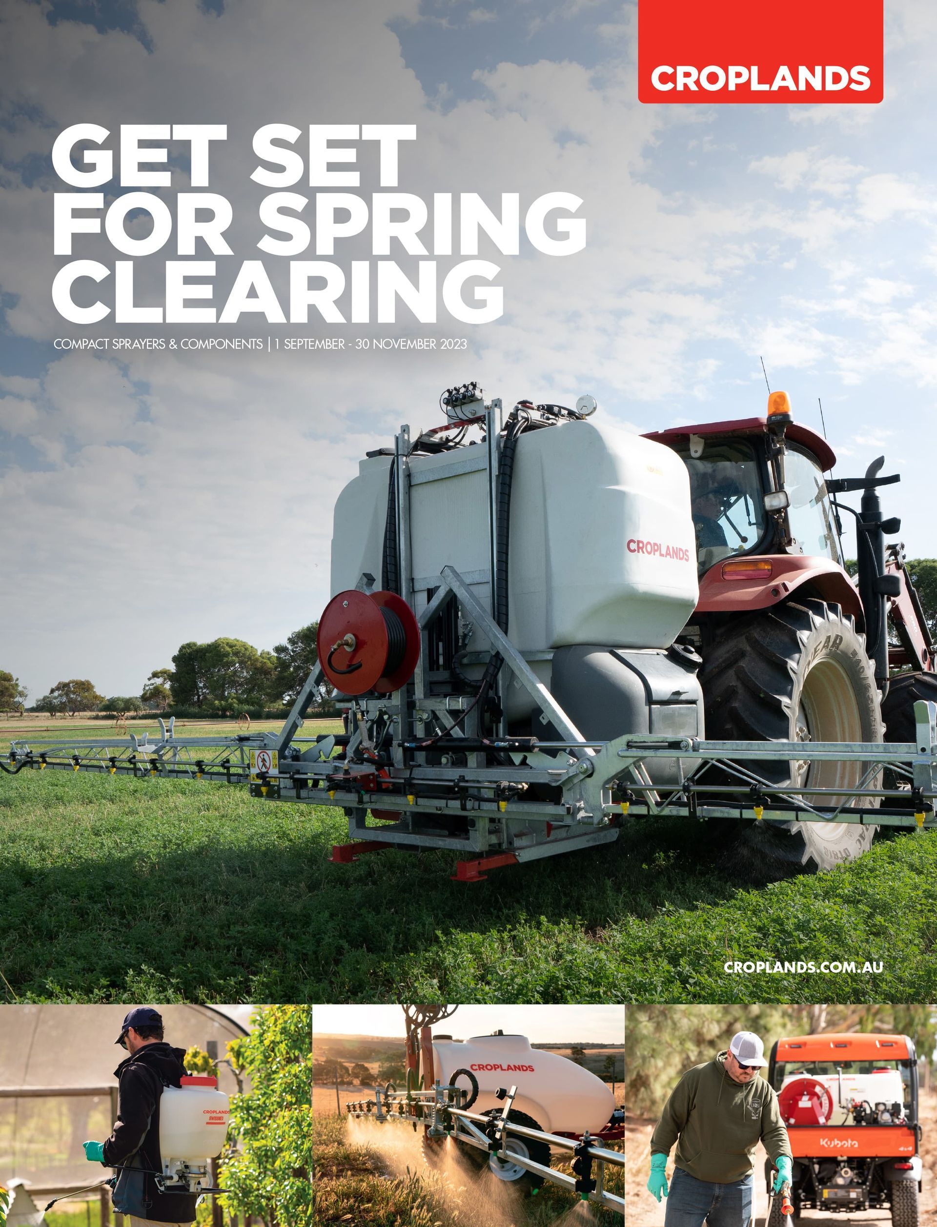 A man is spraying a field with a tractor.