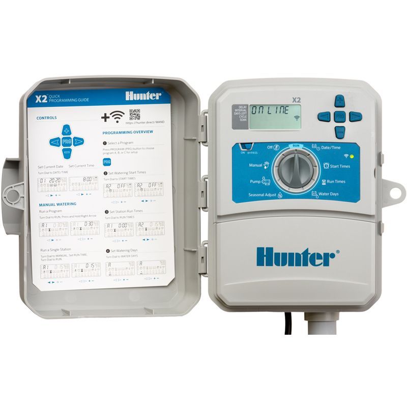 A hunter sprinkler controller with a remote control and instructions.
