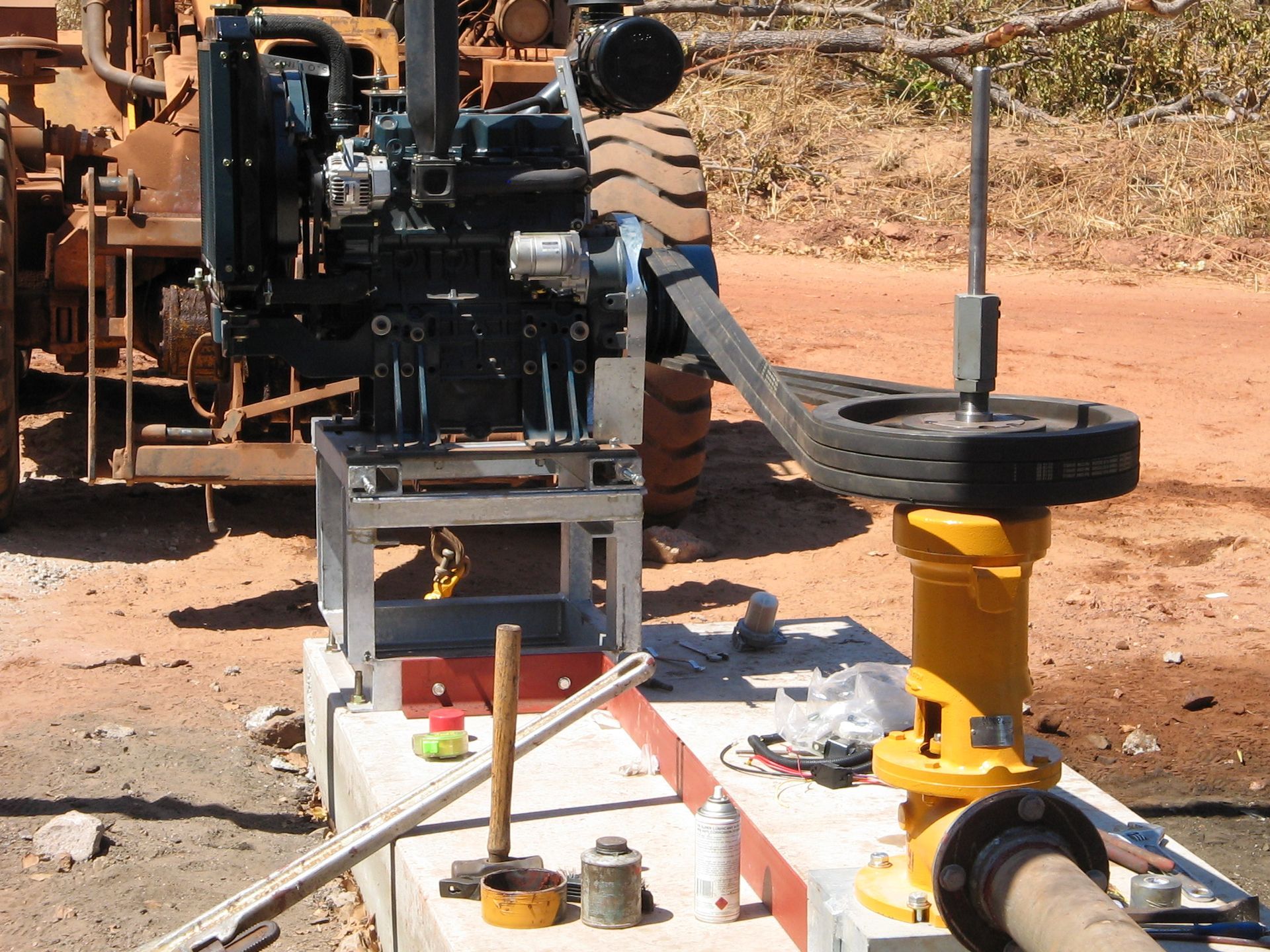 A yellow pipe with a hose attached to it