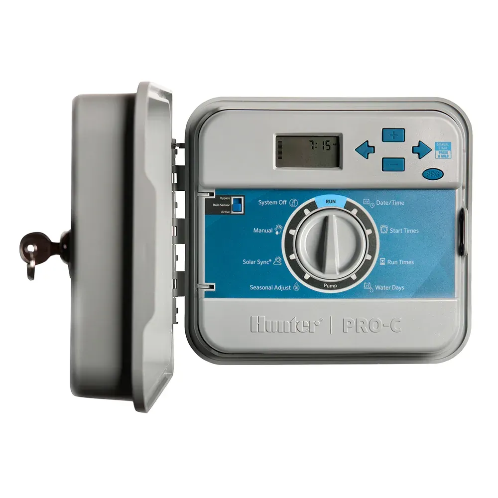 A lawn sprinkler controller with the door open on a white background.