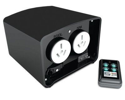 A black box with two outlets and a remote control